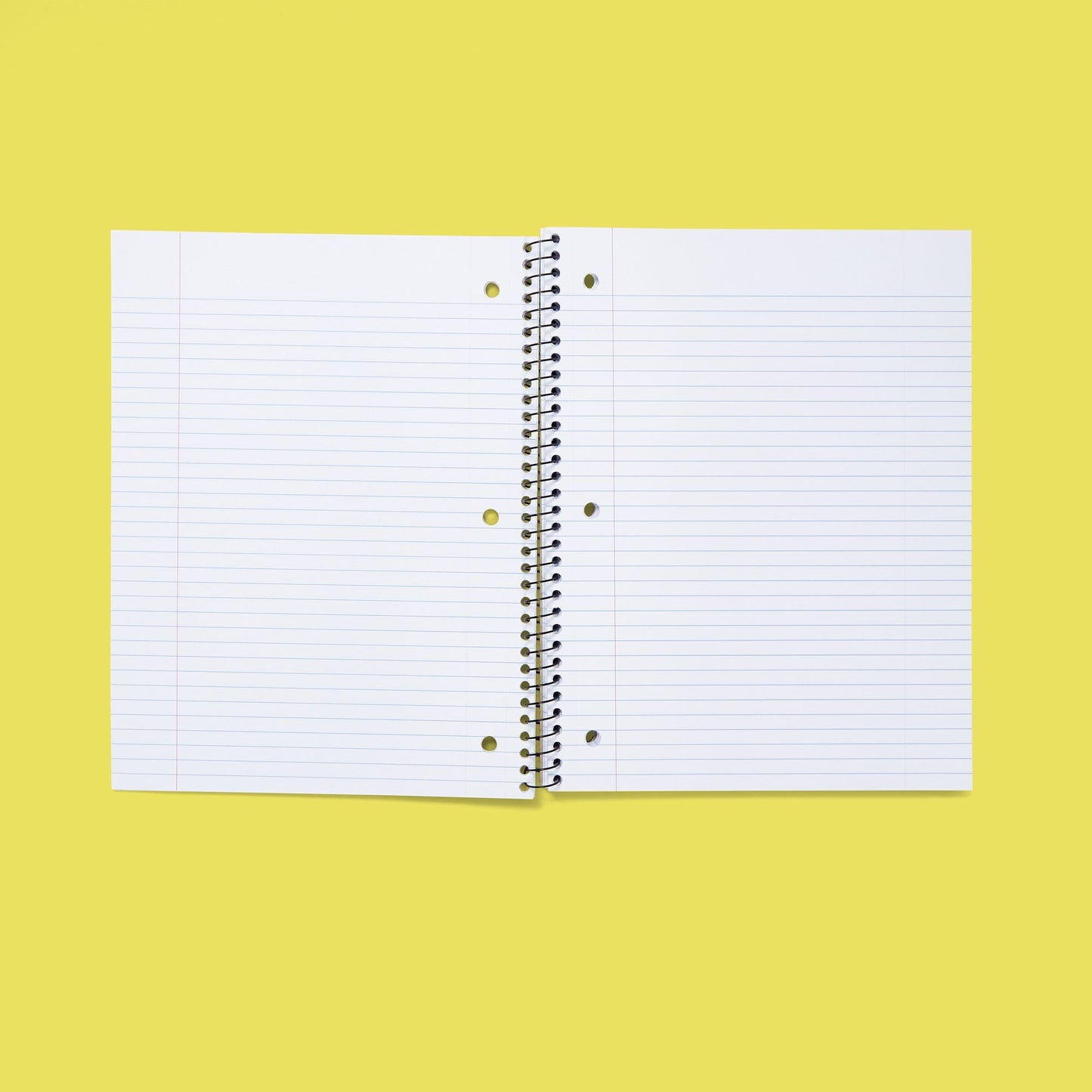 inside of open one subject spiral notebook showing college-ruled paper